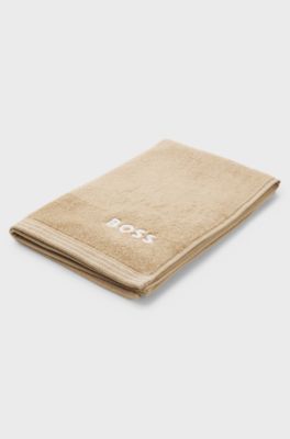 Katoenen gastenhanddoek met logostiksel als contrast, Beige