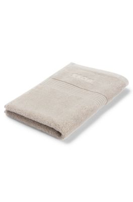 Aegean-cotton guest towel with tonal logo, Beige