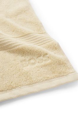 Aegean-cotton guest towel with tonal logo, Beige