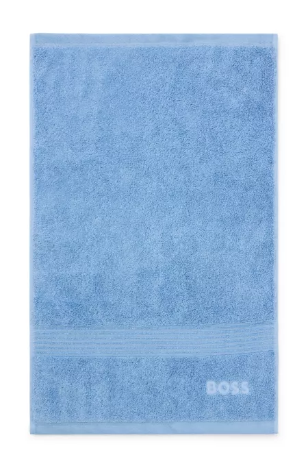 Aegean-cotton guest towel with tonal logo