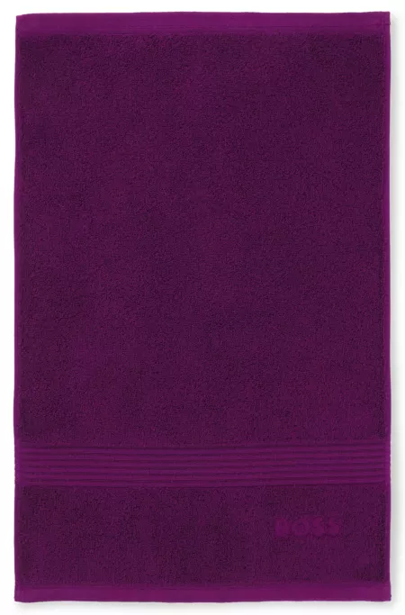 Aegean-cotton guest towel with tonal logo