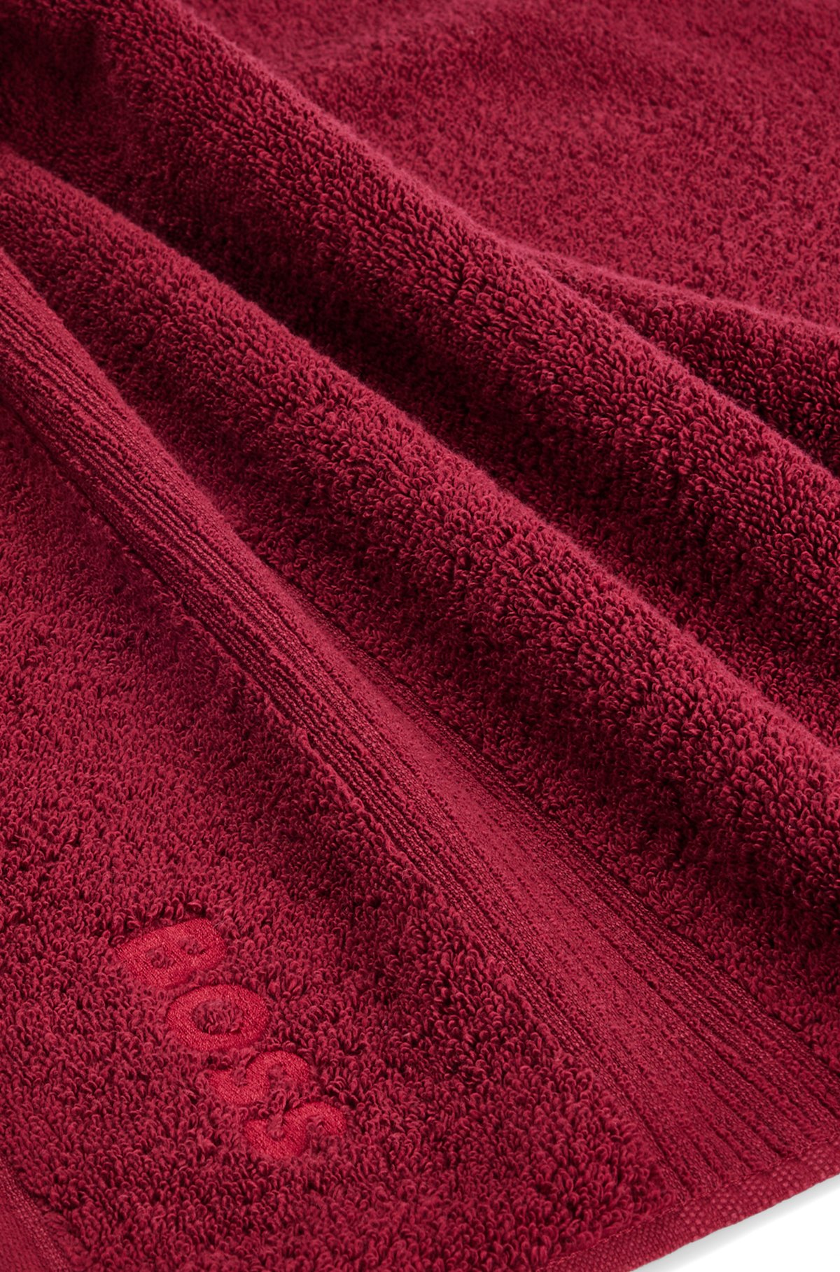 Gæstehåndklæde i ægæisk bomuld med tone-i-tone-logo, Mørkerød