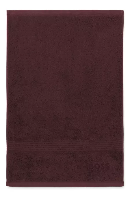 Aegean-cotton guest towel with tonal logo