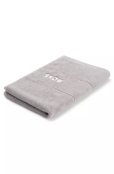 Cotton guest towel with white logo embroidery