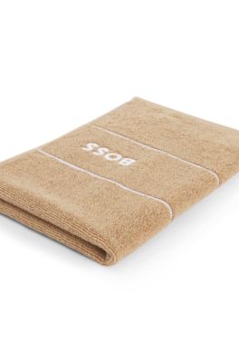 Cotton guest towel with white logo embroidery, Beige