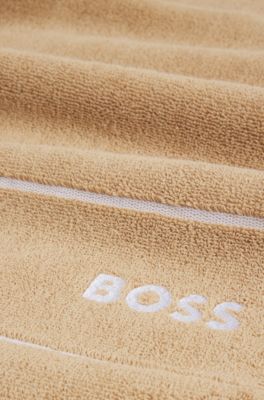 Cotton guest towel with white logo embroidery, Beige