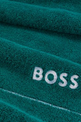 Cotton guest towel with white logo embroidery, Dark Green