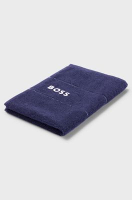 Cotton guest towel with white logo embroidery, Dark Blue