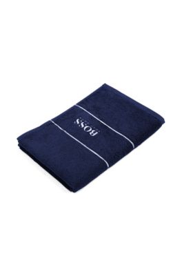 Cotton guest towel with white logo embroidery, Dark Blue