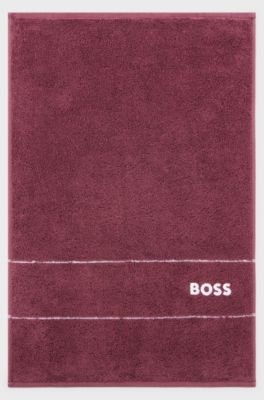 Cotton guest towel with white logo embroidery, Dark Purple