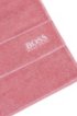 Finest Egyptian cotton guest towel with logo border, light pink