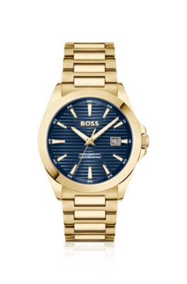 Montre dorée à cadran rainuré bleu