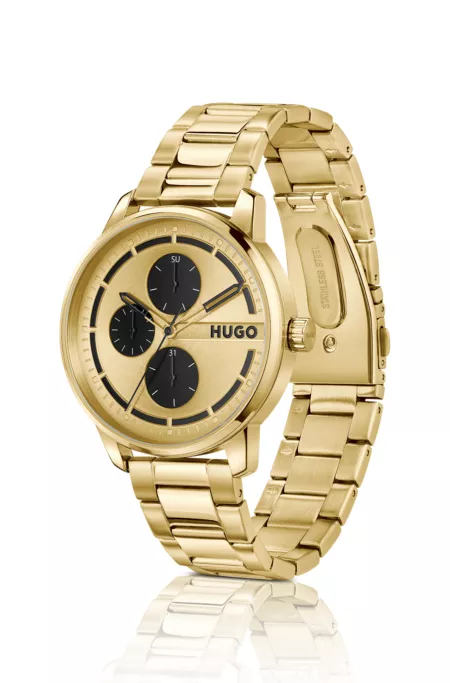 Gold-tone watch with black subeyes