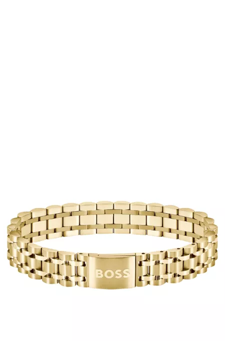 Gold-tone cuff with logo-engraved magnetic closure