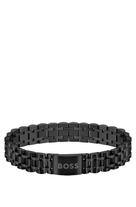 Black-steel cuff with magnetic logo closure