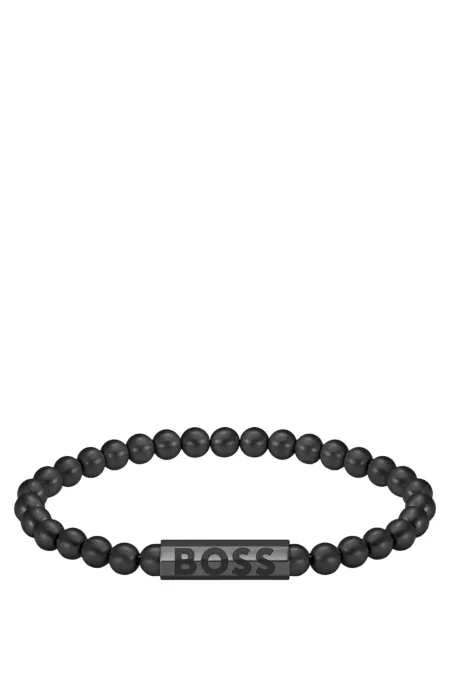 Black-beaded cuff with logo closure