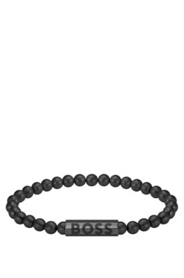 Bracelet à perles noires avec fermoir logoté