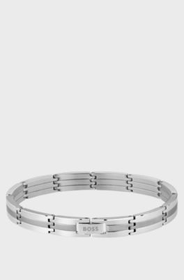 Silver-tone striped cuff with logo clasp, Silver tone