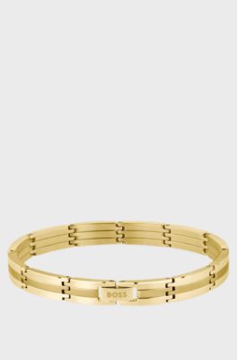 Brazalete a rayas con efecto dorado y cierre de logo, Tono dorado