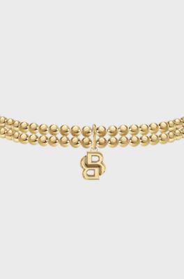Double-row bracelet in a light-yellow-gold tone , Gold tone