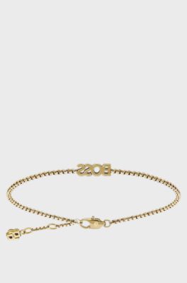 Logo bracelet in a light-yellow-gold tone, Gold tone