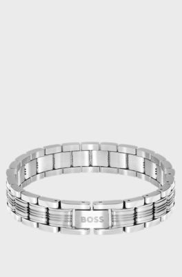 Modern bracelet with understated brand details, Silver tone