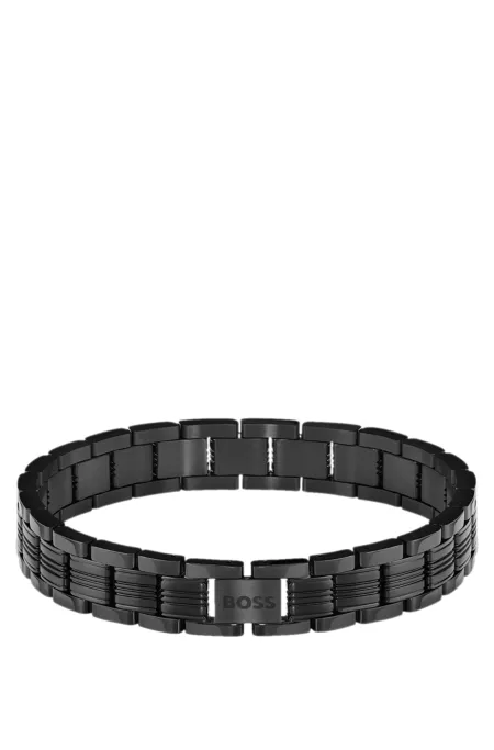 Watch-style cuff in black with engraved logo
