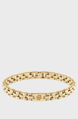 Light-yellow-gold-tone cuff with logo details, Gold tone
