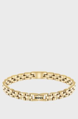 Light-yellow-gold-tone cuff with logo details, Gold tone