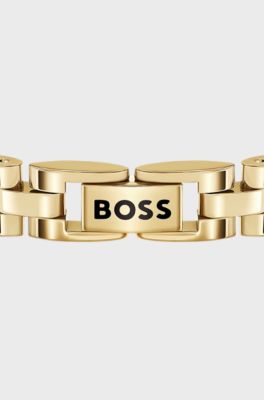Light-yellow-gold-tone cuff with logo details, Gold tone
