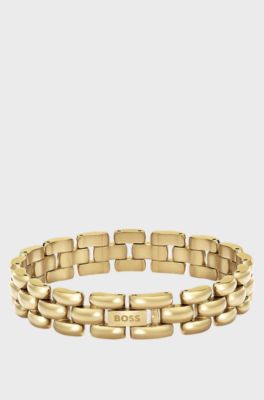 Polished bracelet with engraved logo detail, Gold tone
