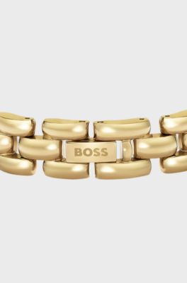 Polished bracelet with engraved logo detail, Gold tone