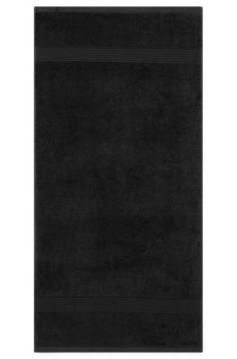Asciugamano in cotone egeo nero con logo tono su tono, Nero