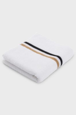 Cotton hand towel with signature-stripe border, White