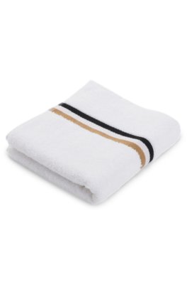 Serviette de toilette en coton avec bordure à rayures emblématiques