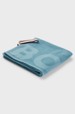 Asciugamano in cotone egeo nero con logo tono su tono, Turchese