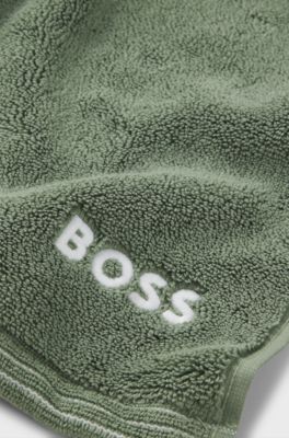 Cotton hand towel with contrast embroidered logo, Green