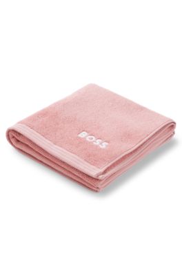 Cotton hand towel with contrast embroidered logo, light pink