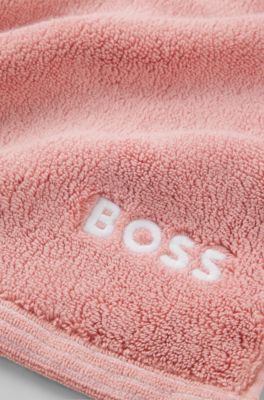 Cotton hand towel with contrast embroidered logo, light pink