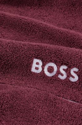 Serviette de toilette en coton avec logo blanc brod&eacute;, Violet fonc&eacute;