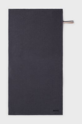 Honeycomb-cotton hand towel with signature-stripe strap, Dark Grey