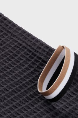 Honeycomb-cotton hand towel with signature-stripe strap, Dark Grey