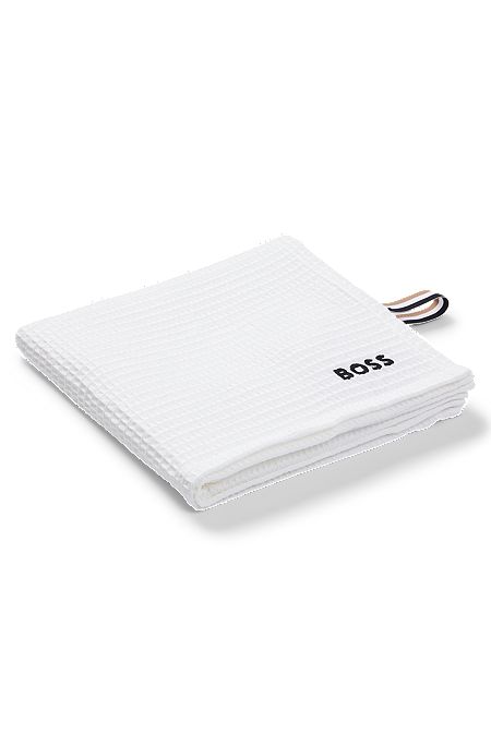 Honeycomb-cotton hand towel with signature-stripe strap, White