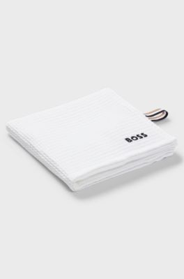 Honeycomb-cotton hand towel with signature-stripe strap, White