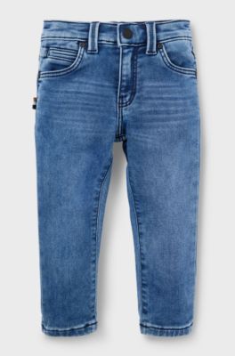 Jeans per bambini in denim elasticizzato con tasca posteriore brandizzata, A disegni