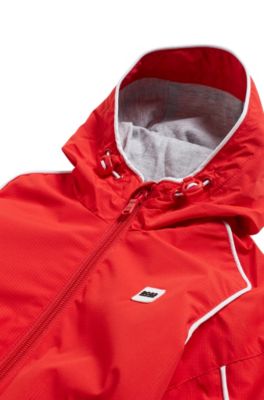 Kids' hooded windbreaker in waterproof fabric with rear logo, Red