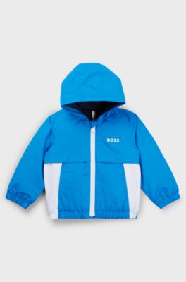Giacca a vento per bambini a blocchi di colore con stampa a monogrammi nascosta, Blu