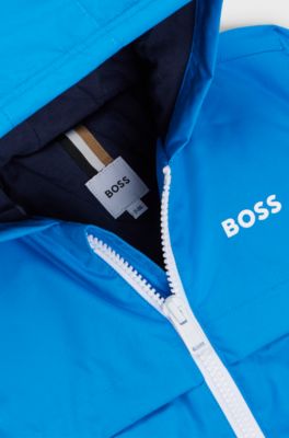 Giacca a vento per bambini a blocchi di colore con stampa a monogrammi nascosta, Blu