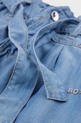 Kids' jeans with metallic logo and tie-up belt, Patterned