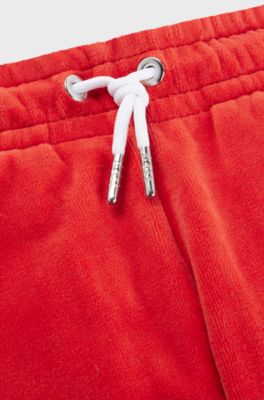 Kids' embroidered-logo tracksuit bottoms in cotton-blend velvet, Red